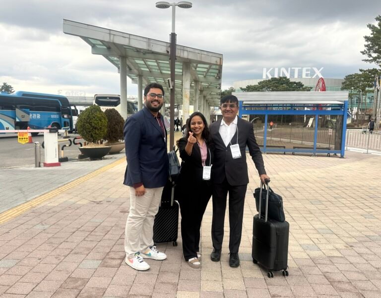 Kenil Dobariya standing at the entrance of Expo